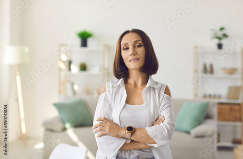 Fotografie Portrait of confident assertive stylish middle aged woman with bob hairstyle, in