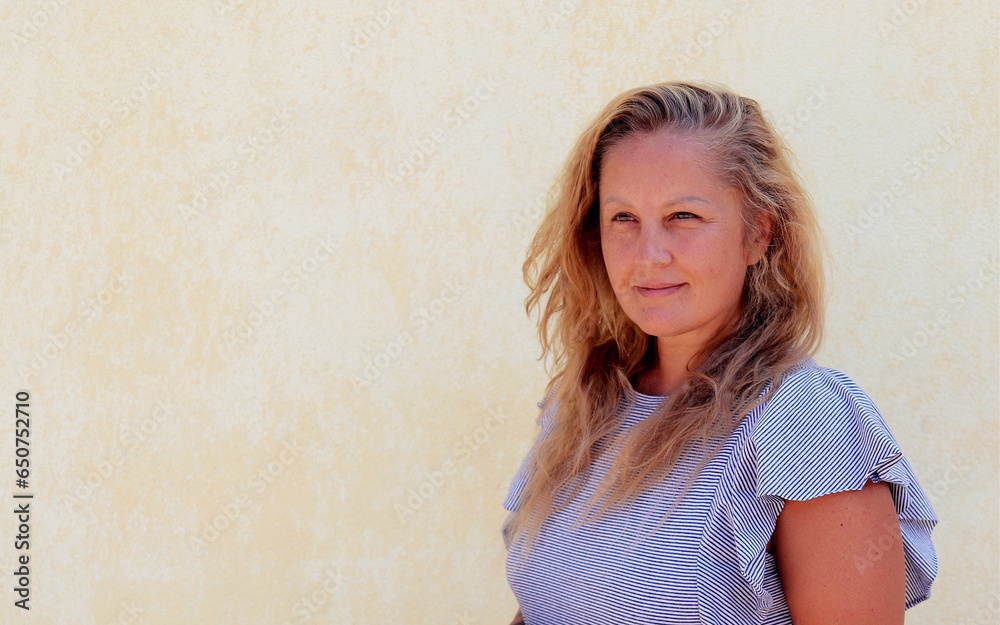 street portrait of a blonde woman of European appearance, selective focus street portrait of a blonde woman of European appearance, selective focus