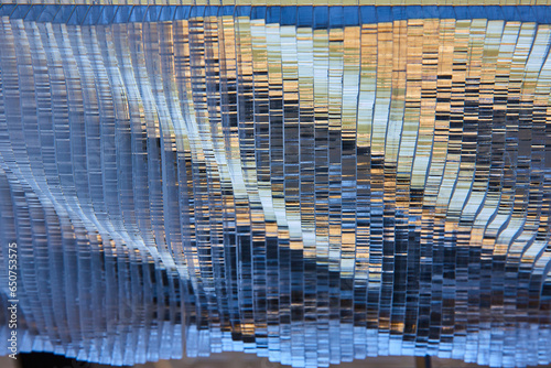 Photography Silvery metallic waves with golden highlights and blue shadows