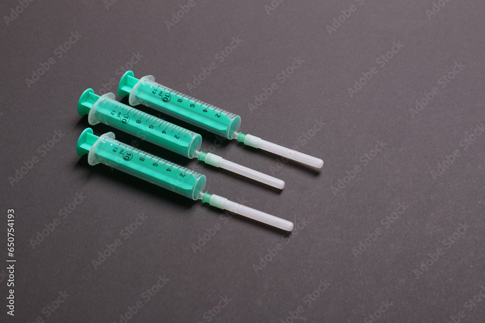 Top view of medical syringes on colorful background. Health care concept with copy space Top view of medical syringes on colorful background. Health care concept with copy space