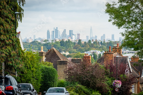 LONDON- Street of house rooftops in Wimbledon with view of the City of London- south west London - UK