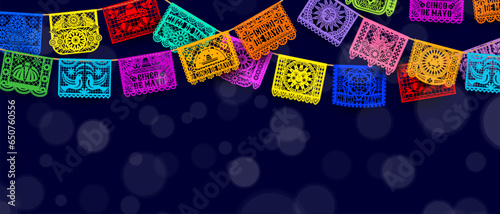 Mexican Cinco De Mayo papel picado paper cut garland flags with bokeh light. Vector background, bursting with intricate, colorful paper cutouts, sets the perfect atmosphere for a lively celebration photo