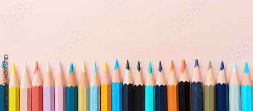 Group of wooden colored pencils on a isolated pastel background Copy space Concept for education creativity art drawing