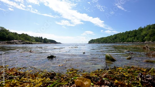 water level ground level shot of water waves rolling into an inlet cove along the Atlantic ocean