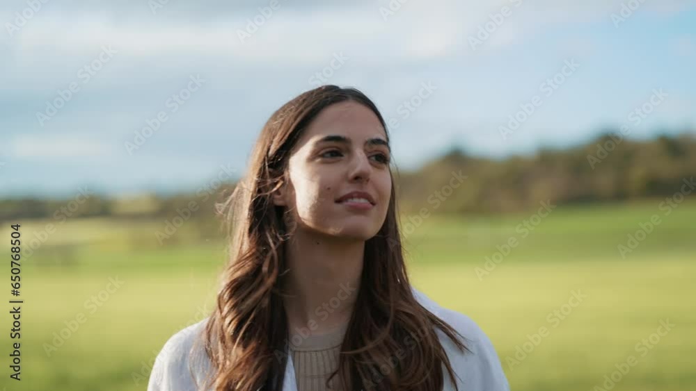 Video of beautiful young woman relaxing while enjoying spring in a field. Video of beautiful young woman relaxing while enjoying spring in a field.