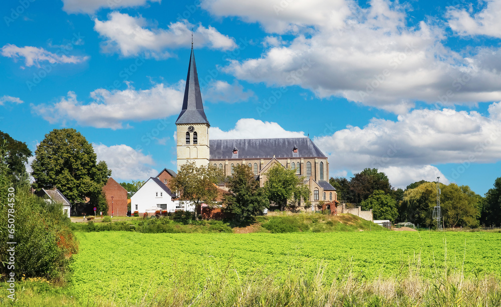 Beautiful belgian countryside landscape with rural village and church tower - Kessenich, Belgium