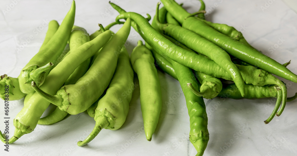 A bunch of green pepper pods. Hot chili pepper. A bunch of green pepper pods. Hot chili pepper.