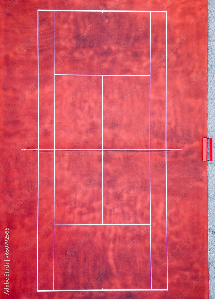 Fototapeta premium Top down aerial view of an empty tennis court, waiting for a game, no people