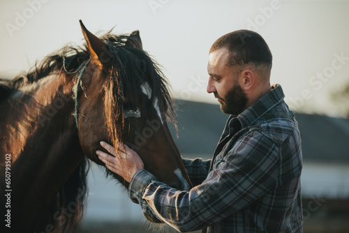 Slika na platnu A man strokes a horse