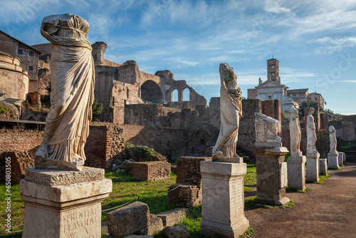 Statues of virgin vestals and ruins of Maxentius Basilica on the Roman Forum in Rome, Italy photo