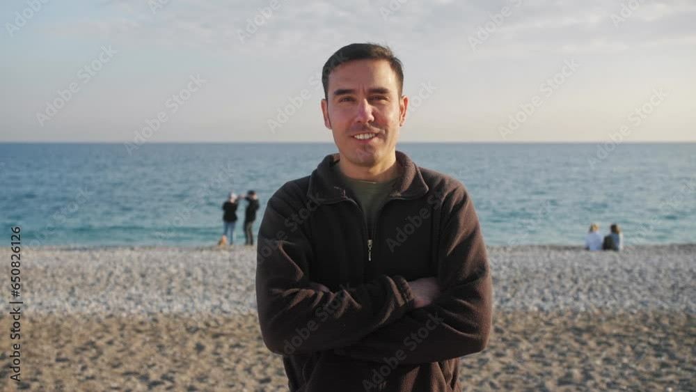 Portrait of a charming caucasian man smiling on a calm sea beach. Portrait of a charming caucasian man smiling on a calm sea beach.