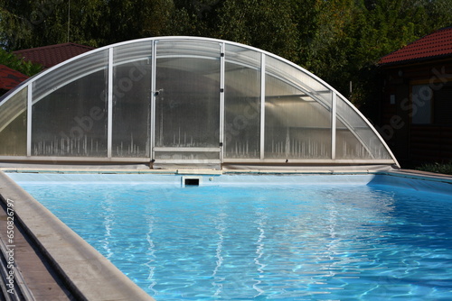 covered outdoor pool, blue water effect © Sabineyro