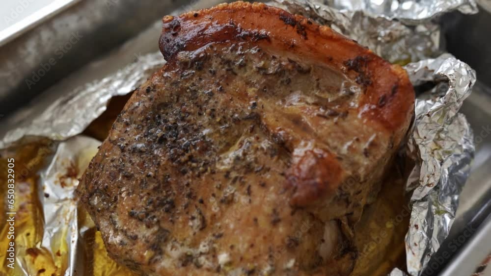 Pork meat baked in foil with spices