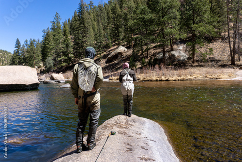 A couple fishes together in Cheesman Canyon, Colorado