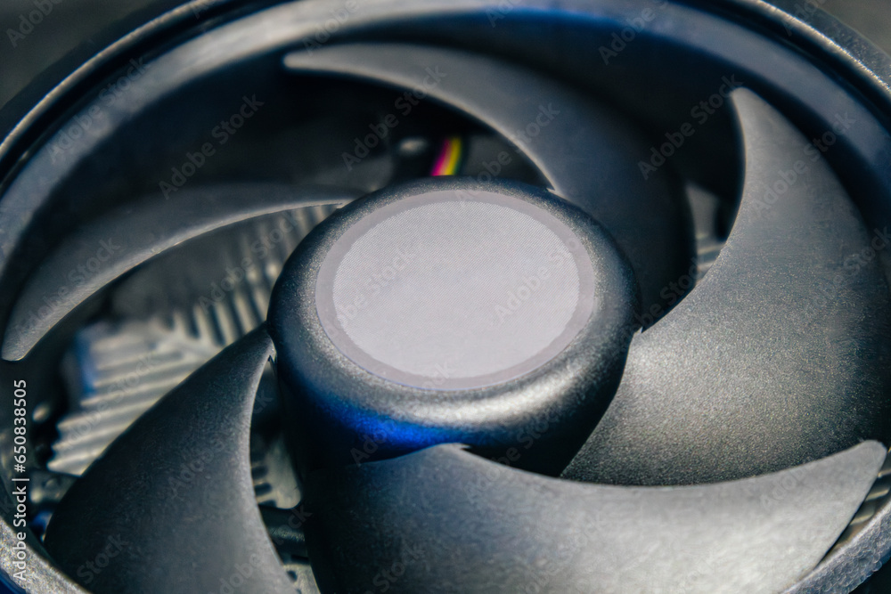 Desktop PC CPU cooling radiator close-up. Black cooler fan, PC hardware details. Components from powerful modern personal computer Desktop PC CPU cooling radiator close-up. Black cooler fan, PC hardware details. Components from powerful modern personal computer