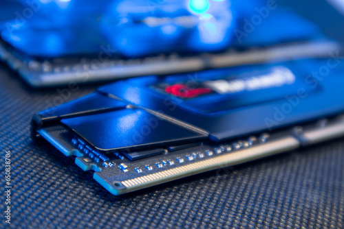 DDR4 DRAM memory modules in blue light. Computer RAM chipset close-up. Desktop PC hardware components