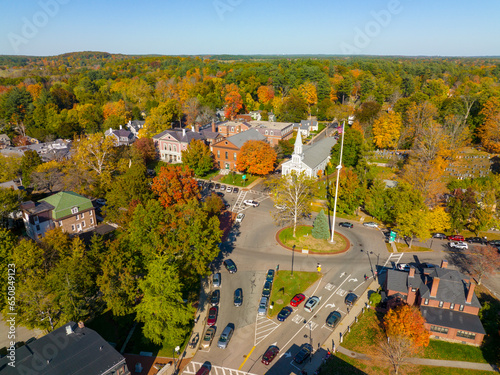 Concord Monument Square aerial view including Holy Family Parish Church and Concord Town Hall in fall with foliage in town center of Concord, Massachusetts MA, USA. 