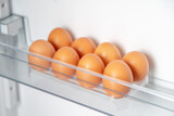 Chicken eggs in the fridge. Eggs are stored at low temperatures.