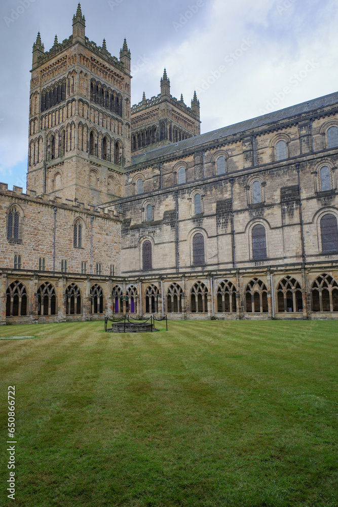 Durham, UK - 12 July, 2023: Cloisters and interior lawn of Durham Cathdral, England