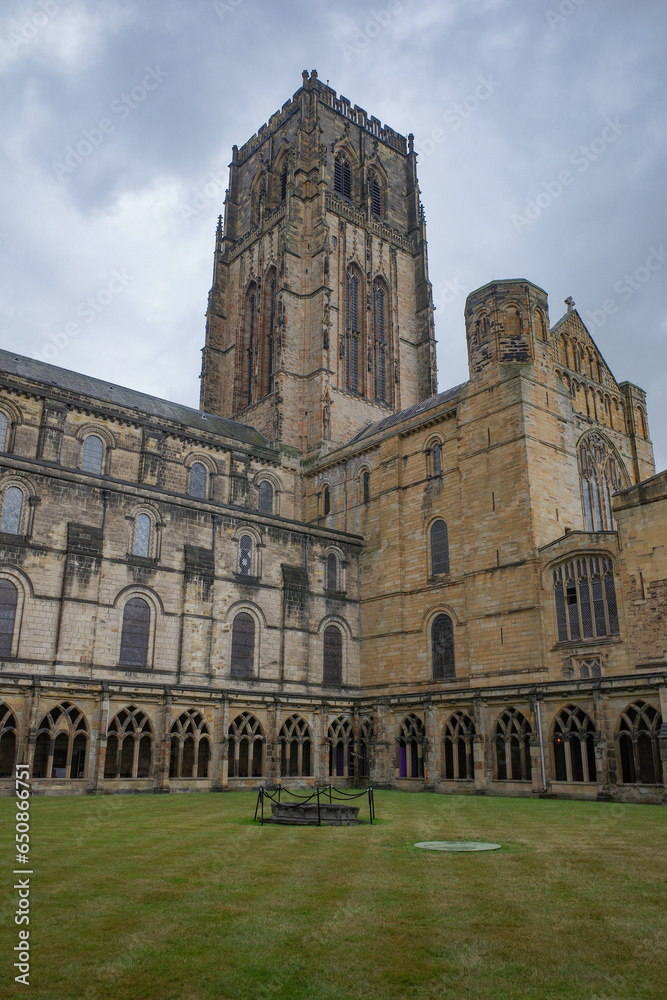Durham, UK - 12 July, 2023: Cloisters and interior lawn of Durham Cathdral, England Durham, UK - 12 July, 2023: Cloisters and interior lawn of Durham Cathdral, England