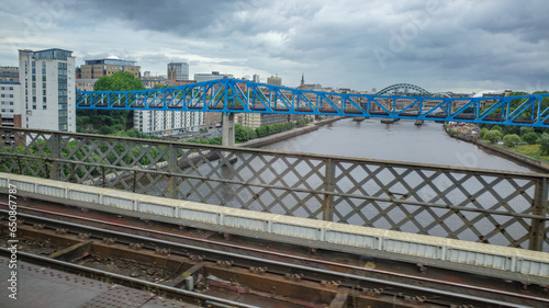 Newcastle upon Tyne, UK - 12 July, 2023: Views of the River Tyne from a train approaching Newcastle Central station photo