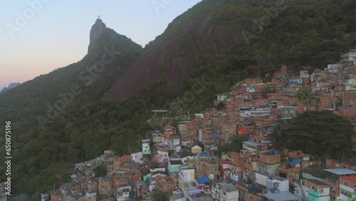 Aerial of hillside favela beneath Christ the Redeemer in Rio de Janeiro, Brazil photo