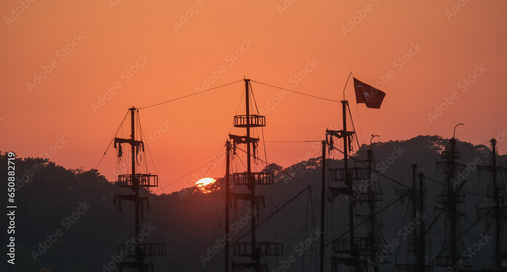 sailing ship tower silhouettes during the sunset