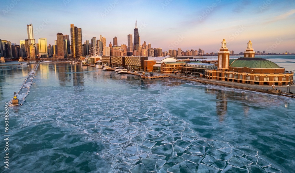 Aerial Chicago skyline at sunrise with a view of the navy pier and frozen lake Michigan - obrazy, fototapety, plakaty 