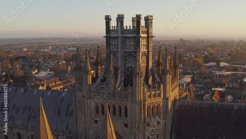 Aerial close up Cathedral of Ely city in Cambridgeshire, England, UK. Famous travel destination and anglican churches .Traditional countryside house architecture background photo