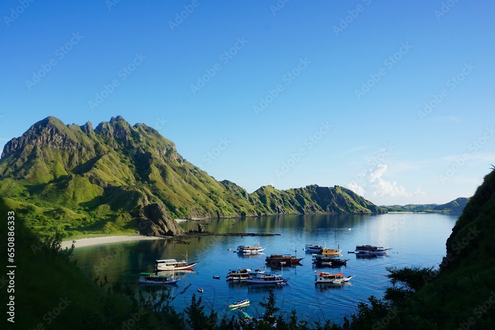 Boats anchoring in the bay of Padar Island, Komodo national park in Indonesia