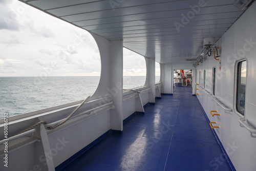 View of a ferry boat corridor with ocean in the background © Alescolam/Wirestock Creators