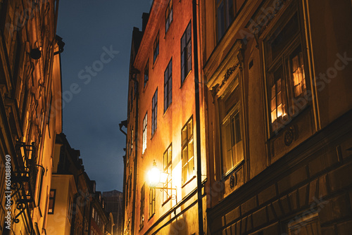 Low angle view of buildings against sky at night