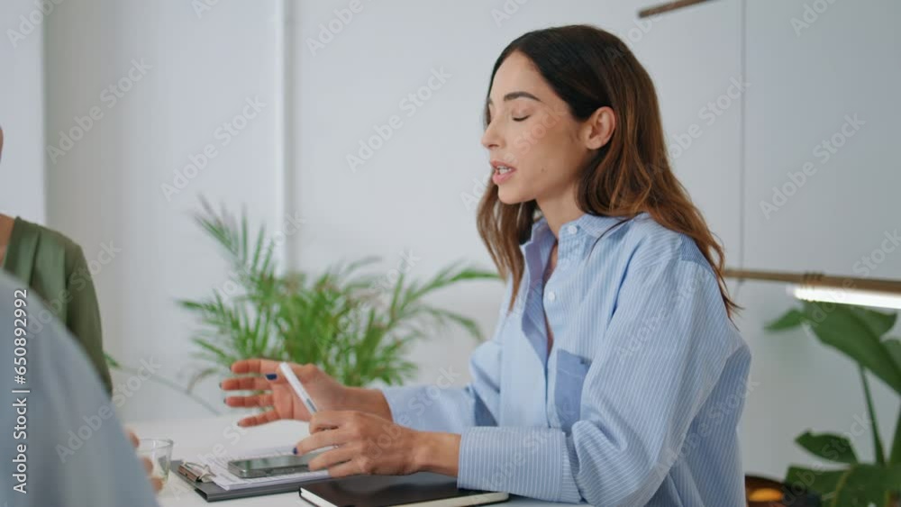 Corporate mentor talking colleagues in office closeup. Attractive woman sharing Corporate mentor talking colleagues in office closeup. Attractive woman sharing