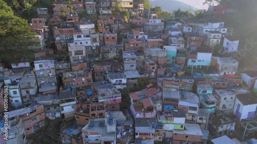 Slow aerial pullback from colourful favela houses in Rio de Janeiro, Brazil photo