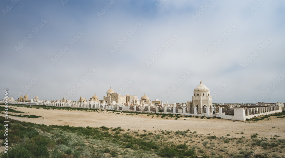 Muslim cemetery in Kazakhstan with buildings and structures, clan mausoleums in the Kazakh steppe