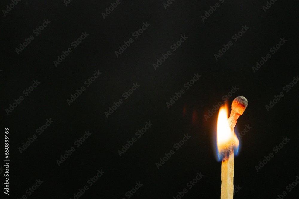 Matchsticks burned in the dark background. Matchsticks burned in the dark background.