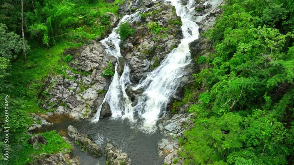 Khlong Nam Lai Waterfall is situated in Khlong Lan National Park. The park is known for its lush, tropical rainforests, diverse wildlife, and pristine natural landscapes. Thailand. Drone aerial view.
Khlong Nam Lai Waterfall is situated in Khlong Lan National Park. The park is known for its lush, tropical rainforests, diverse wildlife, and pristine natural landscapes. Thailand. Drone aerial view.