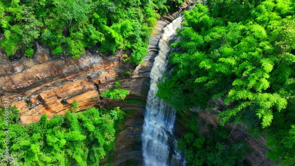 A colossal waterfall cascades from a towering cliff, descending from the heavens, its waters tumbling gracefully in majestic freefall, exploding into a frothy, white spray in a pool below. Thailand.
A colossal waterfall cascades from a towering cliff, descending from the heavens, its waters tumbling gracefully in majestic freefall, exploding into a frothy, white spray in a pool below. Thailand.