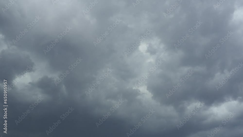 Sky and gray clouds. Puffy fluffy dark clouds. Cumulus cloud cloudscape time lapse. Autumn or winter sky time lapse. Nature weather forecast. Rainy clouds background. Cloud dramatic rapid video storm.