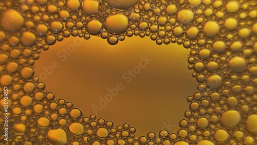 Top view of gold soap bubbles  on color background