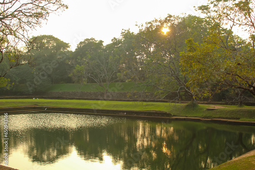 Fototapeta Naklejka Na Ścianę i Meble -  The view of the pond at the Sigiriya during the sunset, Sri lanka