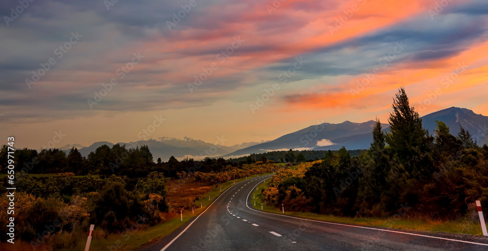 The Road trip view of  travel scene and  foggy in the morning with sunrise sky scene at fiordland national park