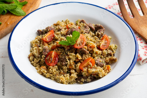 Couscous with vegetables and beef marinated with fresh mint.
