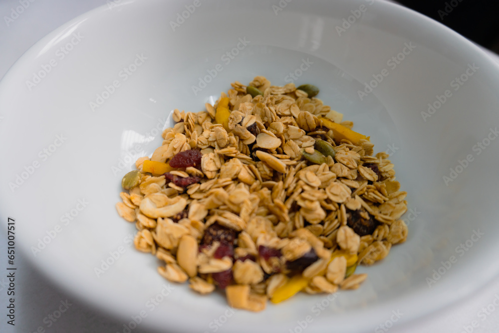 Breakfast granola with fruit in a white bowl Food photography Breakfast granola with fruit in a white bowl Food photography