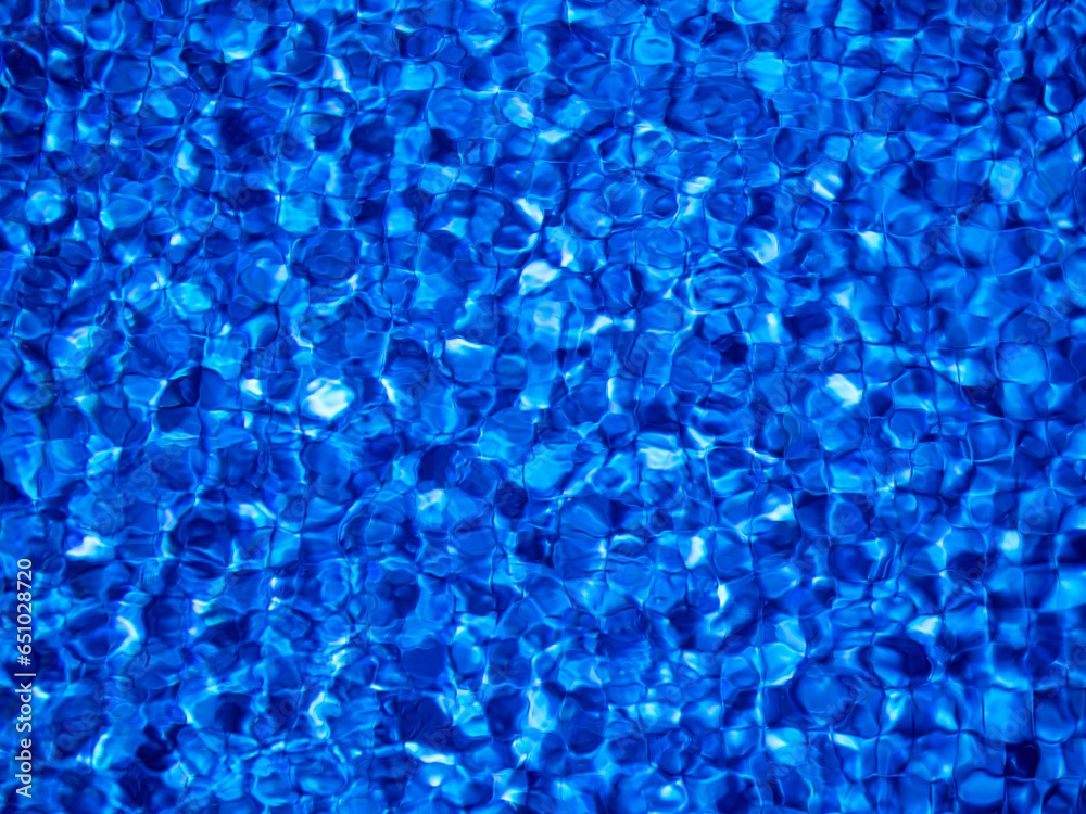 Water surface in a swimming pool with blue mosaic. Abstract background for swimming, summer sport, recreation, tourism. Water surface in a swimming pool with blue mosaic. Abstract background for swimming, summer sport, recreation, tourism.