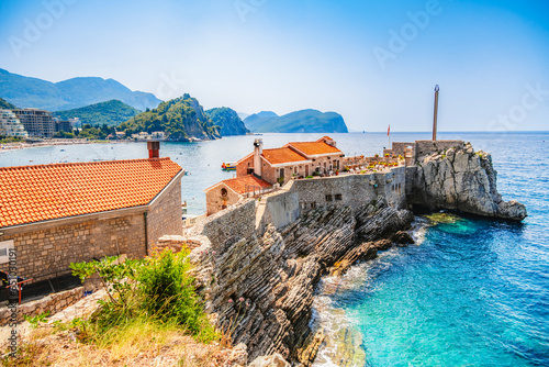 View of the rocky cape in the resort town of Petrovac, Castello Venetian fortress from the XVI century. Sunny day. Montenegro.