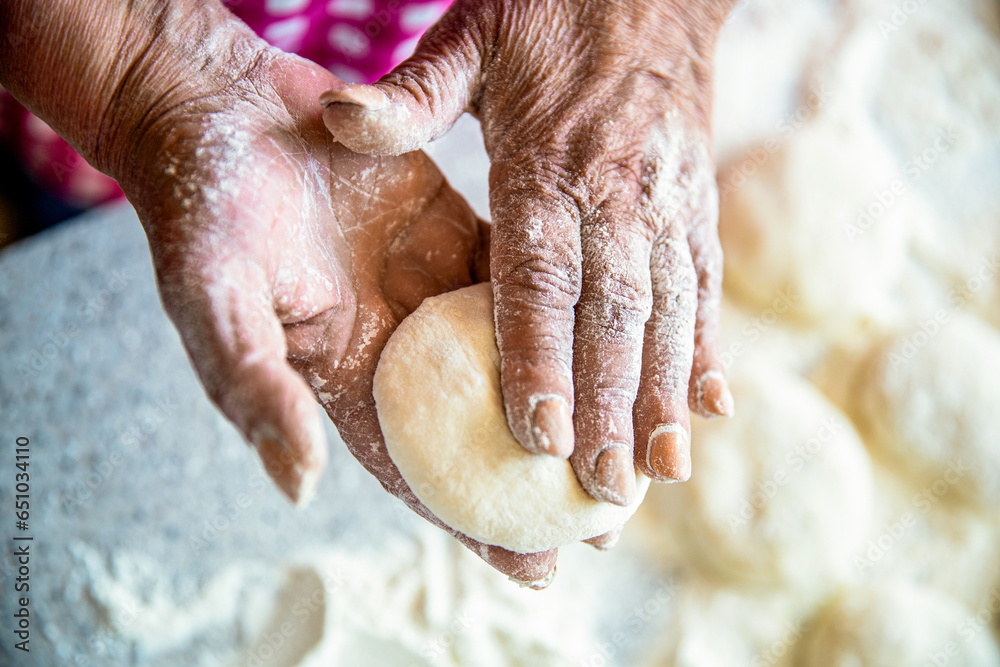 Cooks dough for baking, pieces of raw dough. Homemade cakes dough in the women's hands. Process of making pies, hand. Hands pie dough. Womans hands rolling doughs for pies. Baking at home Cooks dough for baking, pieces of raw dough. Homemade cakes dough in the women's hands. Process of making pies, hand. Hands pie dough. Womans hands rolling doughs for pies. Baking at home