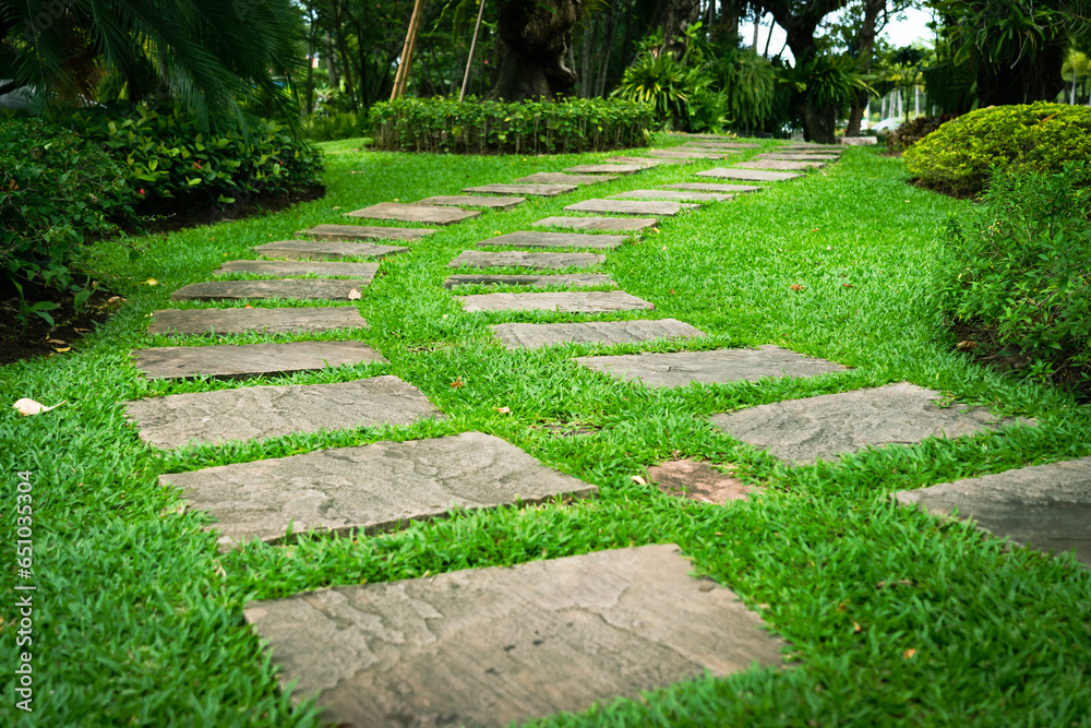 The walkway is laid out with beautiful curved stones in the garden. The walkway is laid out with beautiful curved stones in the garden.