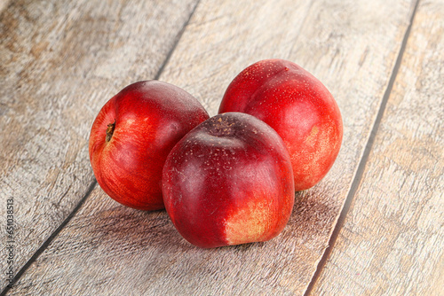 Ripe sweet juicy nectarines heap