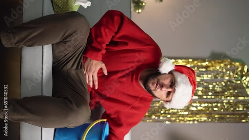 A man suffering from nausea and vomiting after a Christmas party. Food and alcohol poisoning